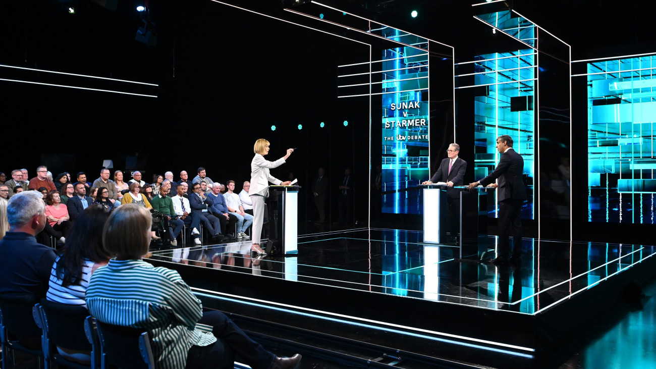 SALFORD, ENGLAND - JUNE 4: (EDITORS NOTE: This Handout image was provided by a third-party organization and may not adhere to Getty Images editorial policy.) In this handout provided by ITV, Julie Etchingham hosts Conservative Prime Minister Rishi Sunak (R) and Labour leader Sir Keir Starmer (C) during first head-to-head debate of the General Election on June 4, 2024 in Salford, England. The first televised debate of the 2024 General Election between Rishi Sunak and Sir Keir Starmer will take place on ITV. (Photo by Jonathan Hordle - ITV via Getty Images)