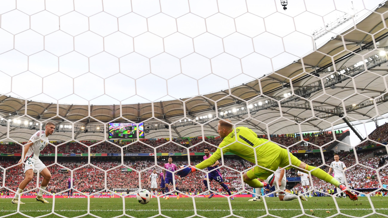 STUTTGART, GERMANY - JUNE 19: (EDITORS NOTE: Image was captured using a static remote camera behind the goal.) Ilkay Guendogan of Germany scores his teams second goal as Peter Gulacsi of Hungary fails to make a save during the UEFA EURO 2024 group stage match between Germany and Hungary at Stuttgart Arena on June 19, 2024 in Stuttgart, Germany. (Photo by Shaun Botterill/Getty Images)