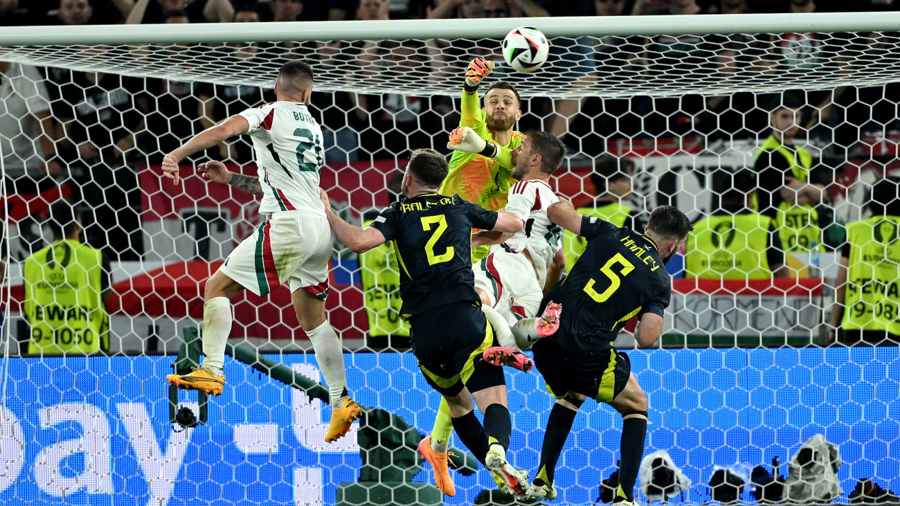 STUTTGART, GERMANY - JUNE 23: Angus Gunn of Scotland collides with Barnabas Varga of Hungary as he punches the ball clear during the UEFA EURO 2024 group stage match between Scotland and Hungary at Stuttgart Arena on June 23, 2024 in Stuttgart, Germany. (Photo by Shaun Botterill/Getty Images)