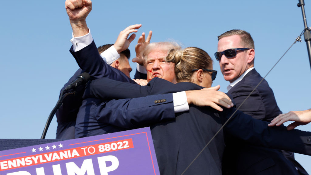 BUTLER, PENNSYLVANIA - JULY 13: Republican presidential candidate former President Donald Trump is rushed offstage during a rally on July 13, 2024 in Butler, Pennsylvania. Butler County district attorney Richard Goldinger said the shooter is dead after injuring former U.S. President Donald Trump, killing one audience member and injuring another in the shooting. (Photo by Anna Moneymaker/Getty Images)