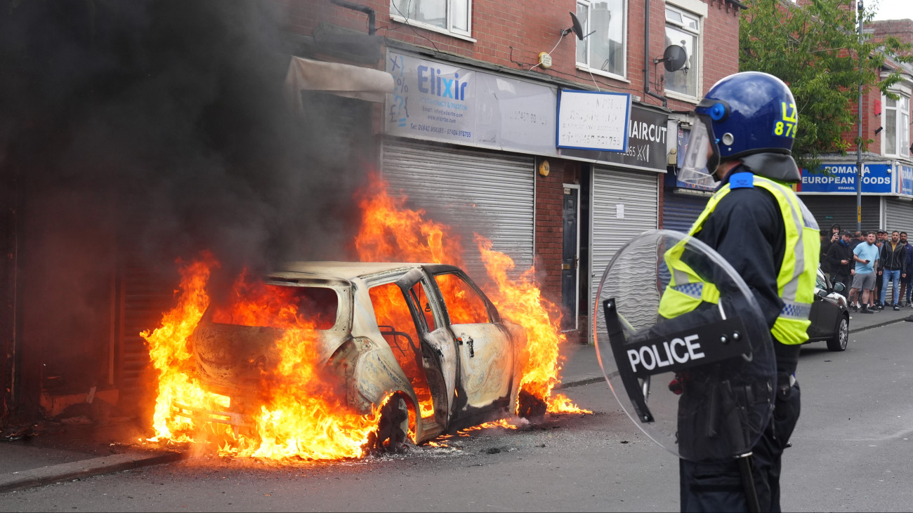 A car burns on Parliament Road, in Middlesbrough, during an anti-immigration protest. Picture date: Sunday August 4, 2024. (Photo by Owen Humphreys/PA Images via Getty Images)