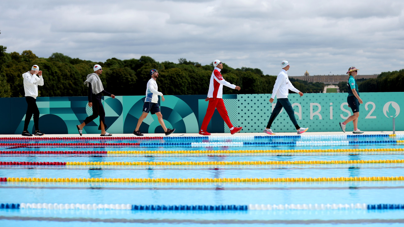 VERSAILLES, FRANCE - AUGUST 09: Ahmed Elgendy of Team Egypt, Fabian Liebig of Team Germany, Bugra Unal of Team Turkiye, Jean-Baptiste Mourcia of Team France, Shuai Luo of Team Peoples Republic of China and Csaba Bohm of Team Hungary walk out prior to  the Menâs Individual, Semi-final A, Swimming 200m Freestyle on day fourteen of the Olympic Games Paris 2024 at Chateau de Versailles on August 09, 2024 in Versailles, France. (Photo by Maja Hitij/Getty Images)