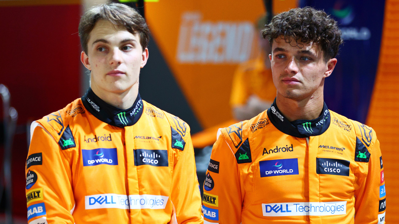 SINGAPORE, SINGAPORE - SEPTEMBER 19: Lando Norris of Great Britain and McLaren and Oscar Piastri of Australia and McLaren pose for a photo in the Paddock during previews ahead of the F1 Grand Prix of Singapore at Marina Bay Street Circuit on September 19, 2024 in Singapore, Singapore. (Photo by Clive Rose - Formula 1/Formula 1 via Getty Images)