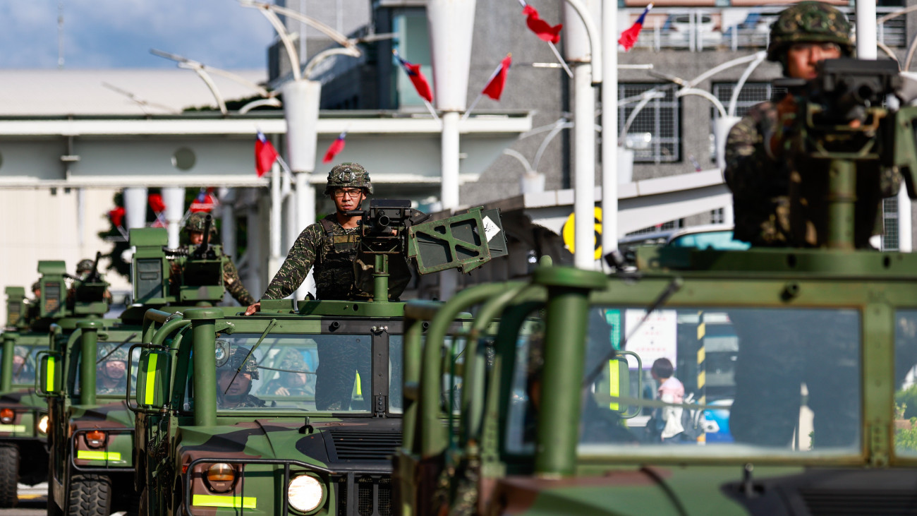 TAIPEI, TAIWAN - OCTOBER 14: A procession of Taiwanese armed military vehicles patrols outside the Songshan Airport in the capital city following Chinas announcement of the military exercise Joint Sword-2024B that encircles Taiwan on October 14, 2024 in Taipei, Taiwan. The military exercises mobilizing the Chinese PLA Navy, Army, Air Force and the Chinese Coast Guards, which are deemed as a punishment to Taiwans call for independence, come following a speech by Taiwanese President William Lai (Lai Ching-te) on the October 10 National Day. In response, the Taiwan Ministry of National Defense said its armed forces have been deployed to monitor the situation and will brace for unfolding developments. (Photo by Daniel Ceng/Anadolu via Getty Images)