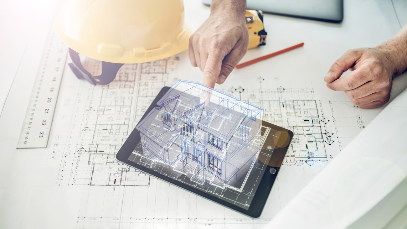 Architect showing a hologram of a house project over a tablet computer. Note to inspector: I am the author of the building project