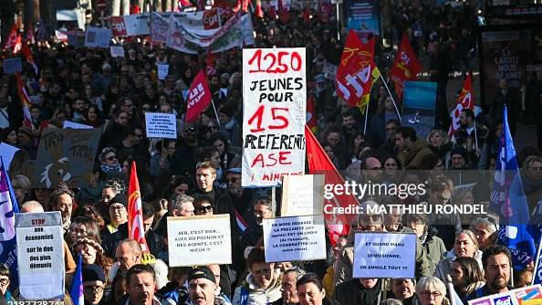 People march during a demonstration in Toulouse, southern France, part of a nationwide day of action and strike by French Public sector workers to protest over separate cost-cutting measures proposed by their ministry earlier this autumn, on December 5, 2024. (Photo by Matthieu RONDEL / AFP) (Photo by MATTHIEU RONDEL/AFP via Getty Images)