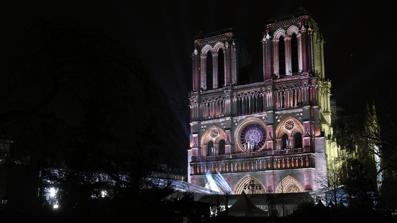 PARIS, FRANCE - DECEMBER 07: A light show is projected on the facade of Notre-Dame de Paris Cathedral at night during a repetition on the eve of its reopening to the public on December 06, 2024 in Paris, France. After five years of restoration, on Saturday, December 7, the Notre-Dame de Paris Cathedral will reopen its doors to the world in the presence of Emmanuel Macron and around 50 heads of state, including Donald Trump, invited for the occasion. (Photo by Pascal Le Segretain/Getty Images for Notre-Dame de Paris)