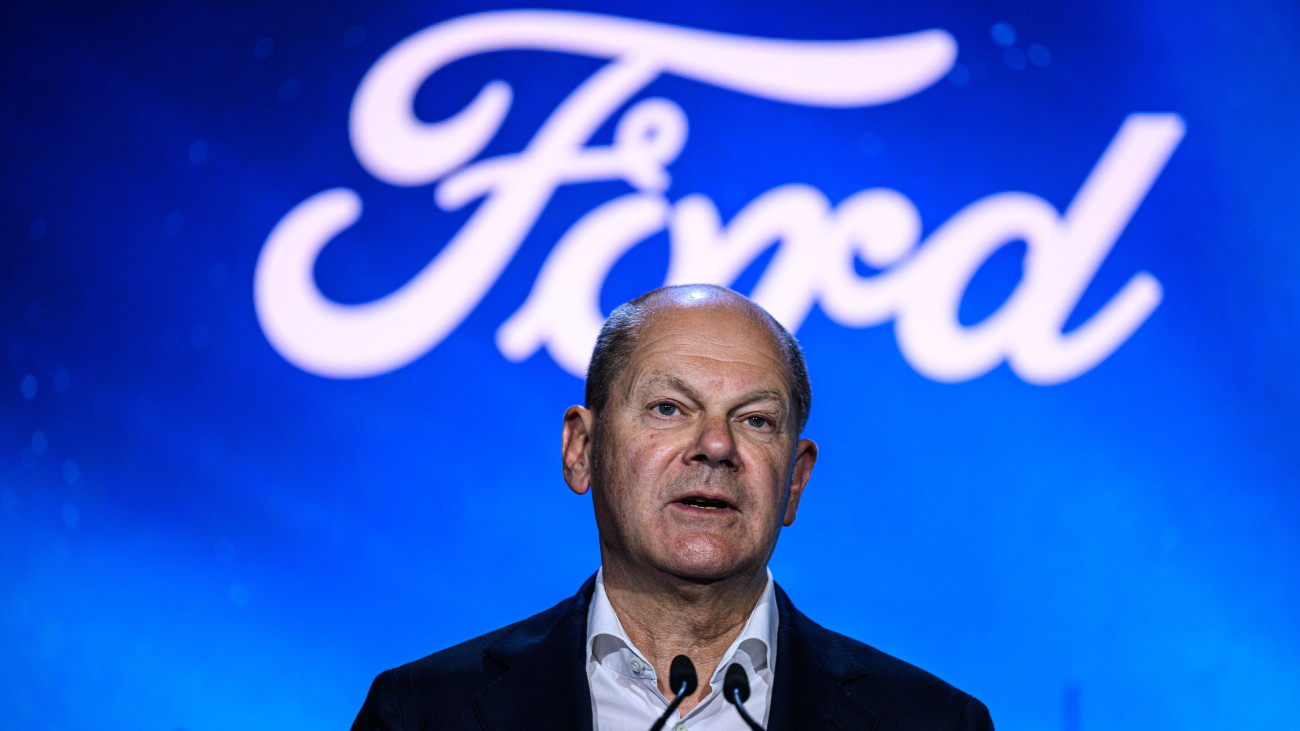 COLOGNE, GERMANY - JUNE 12: German Chancellor Olaf Scholz speaks on stage as he visits the electric car production line at the Ford automobile factory on June 12, 2023 in Cologne, Germany. Dubbed the Cologne Electrification Center, the new factory hall is part of the plants transition to increasing Fords electric car production capacity. (Photo by Lukas Schulze/Getty Images)