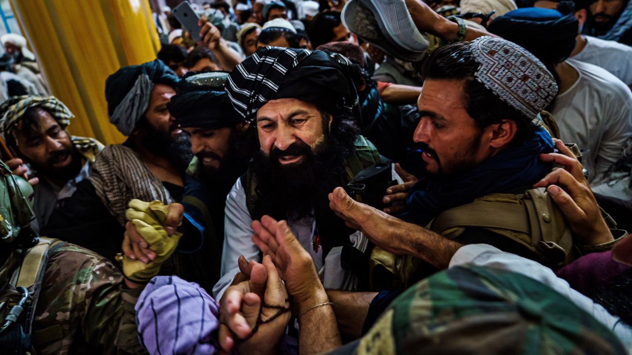 Afghans clamor to greet Khalil Rahman Haqqani, a senior member of the Haqqani network after he delivered a sermon for the first Friday prayers under Taliban rule at the Pul-i-Khishti Mosque in Kabul, Afghanistan, on Aug. 20, 2021. The Haqqani network is a Taliban splinter group considered a terrorist organization by the United States and is one of the fiercest foes American forces spent two decades trying to vanquish in Afghanistan. Flanked by armed guards, Haqqani cradled a rifle: an American-made M-4 carbine. From the pulpit, he delivered a message that was by turns reassuring and menacing: Life under the Taliban would be different than under the deposed national rulers he derided as weak and corrupt. We have freed Afghanistan from Western imperialism and the infidels. Afghanistan will now be a peaceful and prosperous country, where there will be security, no corruption, and no theft, he said. All of the countrys various ethnicities and factions, he added, were brothers.