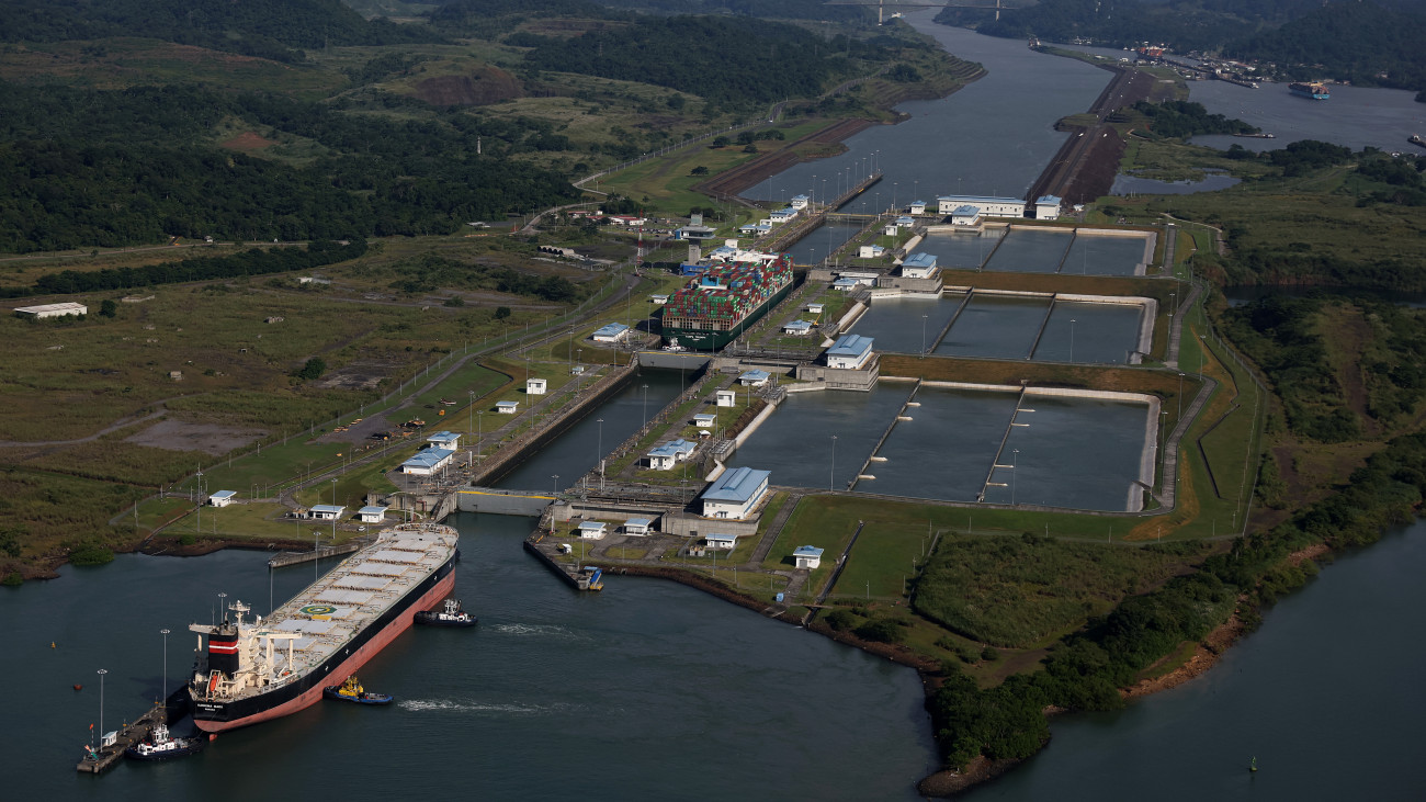 PANAMA CITY, PANAMA - SEPTEMBER 20: In an aerial view, the container ship Tampa Triumph passes through the Miraflores Locks as it transits the Panama Canal on September 20, 2023 in Panama City, Panama. The Panama Canal Authority is continuing to restrict the number of vessels that pass through the Panama Canal locks as drought has caused water levels at Gatun Lake to drop. The locks depend on millions of gallons of fresh water from the manmade lake to fill locks in Panama City and Colon in order to transit shipping vessels from the Pacific Ocean to the Caribbean Sea. Over one hundred ships are waiting to transit the canal and the backup could delay goods heading to the United States for the holiday season. It takes an average of 8-10 hours for a ship to transit the 50 miles through the canal versus several weeks to travel thousands of miles around Cape Horn and the southernmost parts of South America. (Photo by Justin Sullivan/Getty Images)