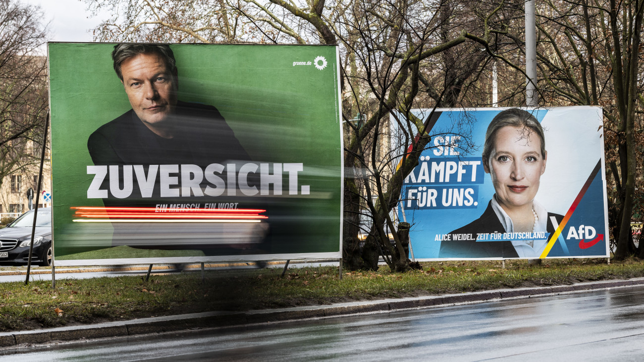 BERLIN, GERMANY - JANUARY 26: Election campaign billboard of Alternative for Germany (AfD) party and faction co-chairwoman and top candidate for the federal election Alice Weidel (R) and of Robert Habeck, Economy and Climate Action Minister and Greens Party chancellor candidate stand on the street as cars past by on January 26, 2025 in Berlin, Germany. Germany is scheduled to hold snap parliamentary elections on February 23 following the collapse of the three-party federal government coalition last November.  (Photo by Maja Hitij/Getty Images)