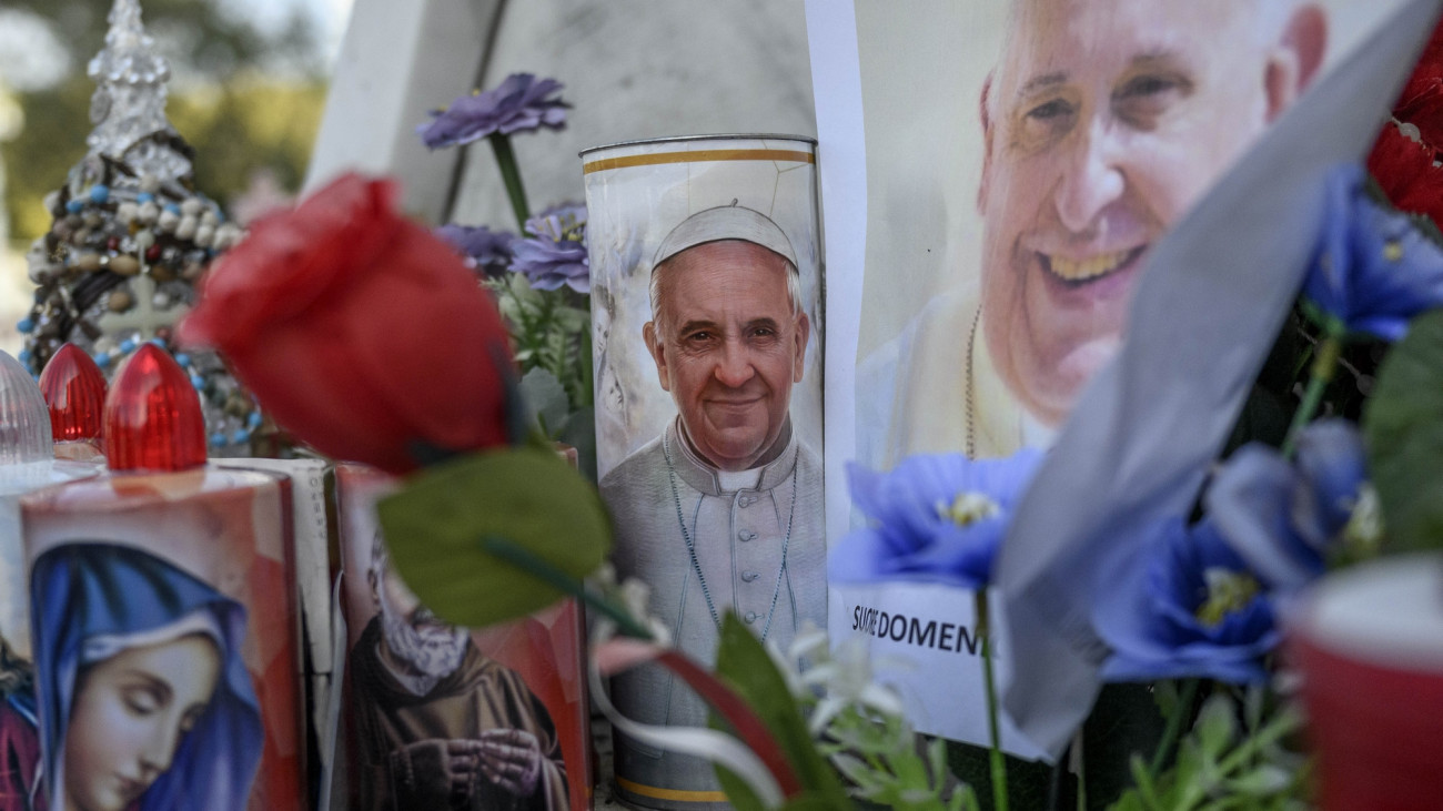 ROME, ITALY - FEBRUARY 23: Candles with a portrait of Pope Francis are seen outside the Policlinico A. Gemelli Hospital where Pope Francis is hospitalized for pneumonia, on February 23, 2025 in Rome, Italy. Pope Francis was hospitalized in Rome on February 14 with bronchitis, and has developed pneumonia in both his lungs. On Sunday morning, the Holy See Press Office said Pope Francis had a peaceful ninth night in Romes Gemelli hospital where he is being treated for double pneumonia. (Photo by Antonio Masiello/Getty Images)