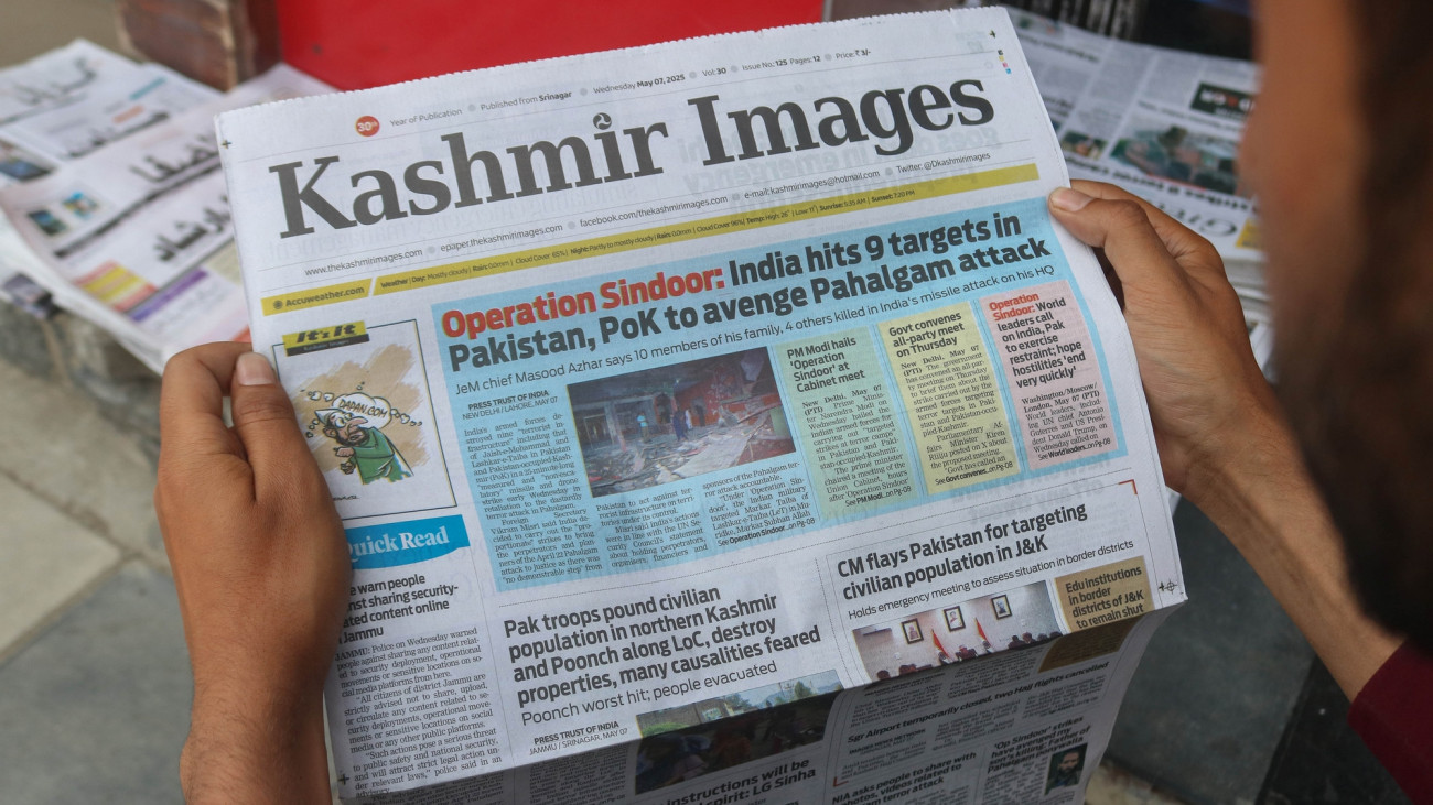 A man reads a newspaper with the front-page news of Operation Sindoor in Srinagar, Jammu and Kashmir, on May 8, 2025. Indian and Pakistani soldiers exchange small arms and artillery fire overnight along the Line of Control (LoC), the de facto border dividing the two sides of Kashmir, the Indian army says on May 8. Tensions between the two nuclear-armed neighbors escalate, sparking fear and uncertainty in the region. On May 7, the Indian Armed Forces launch Operation Sindoor, hitting alleged terrorist infrastructure in Pakistan and Pakistan-occupied Jammu and Kashmir. The Indian government states that it carries out military strikes on nine sites in Pakistan in retaliation for the deadly militant attack on tourists at the popular resort town of Pahalgam in south Kashmir on April 22, 2025, which leaves 26 tourists dead. (Photo by Firdous Nazir/NurPhoto via Getty Images)