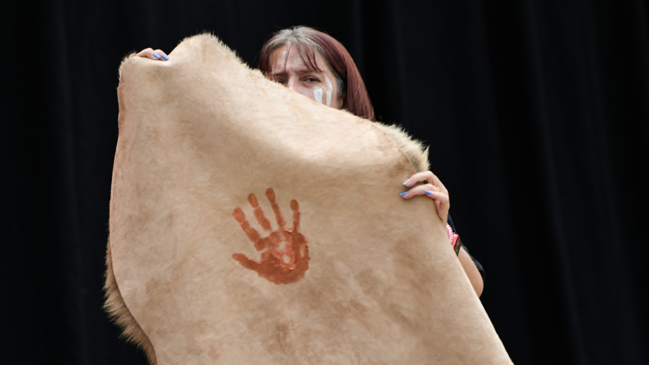 ADELAIDE, AUSTRALIA - JANUARY 26: A performer shows an oche hand print on a kangaroo skin to mark the massacres of Aboriginal and Torres Strait Islanders during a Survival Day Tandanyangga event on January 26, 2025 in Adelaide, Australia. Australia Day, formerly known as Foundation Day, is the official national day of Australia and is celebrated annually on January 26 to commemorate the arrival of the First Fleet to Sydney in 1788. Many indigenous Australians refer to the day as Invasion Day and there is a small but growing movement to change the date amid broader debate on the days significance. (Photo by Tracey Nearmy/Getty Images)