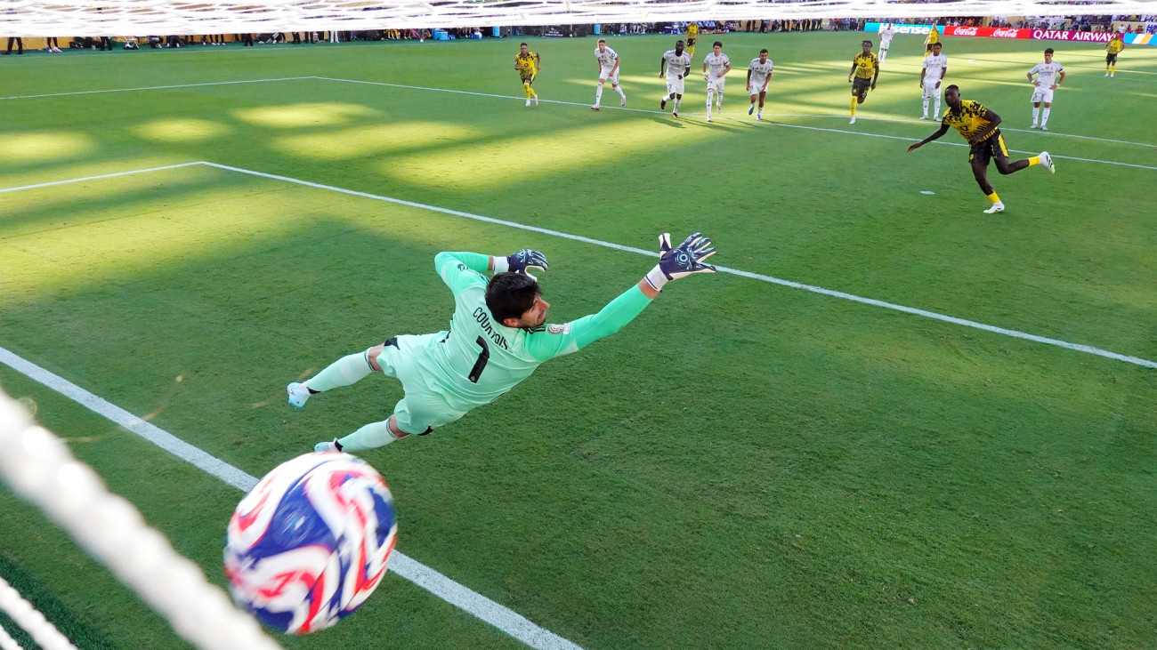 EAST RUTHERFORD, NEW JERSEY - JULY 05: (EDITORS NOTE: In this photo taken from a remote camera from inside the goal.) Serhou Guirassy #9 of Borussia Dortmund scores his teams second goal from a penalty kick past Thibaut Courtois #1 of Real Madrid C.F. during the FIFA Club World Cup 2025 quarter-final match between Real Madrid CF and Borussia Dortmund at MetLife Stadium on July 05, 2025 in East Rutherford, New Jersey. (Photo by Luke Hales/Getty Images)