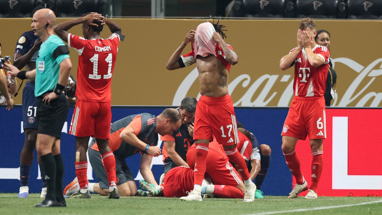 ATLANTA, GEORGIA - JULY 05: Kingsley Coman, Michael Olise and Joshua Kimmich of FC Bayern Munchen react after Jamal Musiala #42 is injured during the FIFA Club World Cup 2025 quarter-final match between Paris Saint-Germain and FC Bayern MĂźnchen at Mercedes-Benz Stadium on July 05, 2025 in Atlanta, Georgia. (Photo by Alex Grimm/Getty Images)