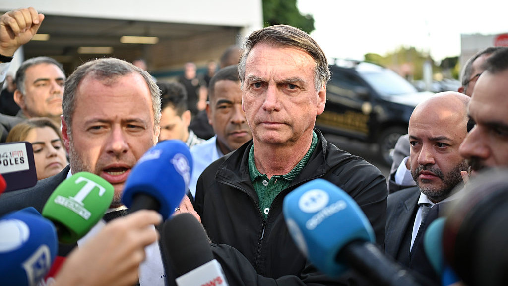 Jair Bolsonaro, Brazils former president, speaks to members of the media after testifying at the Federal Police station in Brasilia, Brazil, on Thursday, June 5, 2025. A Brazilian Supreme Court justice has authorized the federal police to investigate one of the sons of former President Jair Bolsonaro over allegations that he sought to intimidate members of the court while in the US. Photographer: Ton Molina/Bloomberg via Getty Images