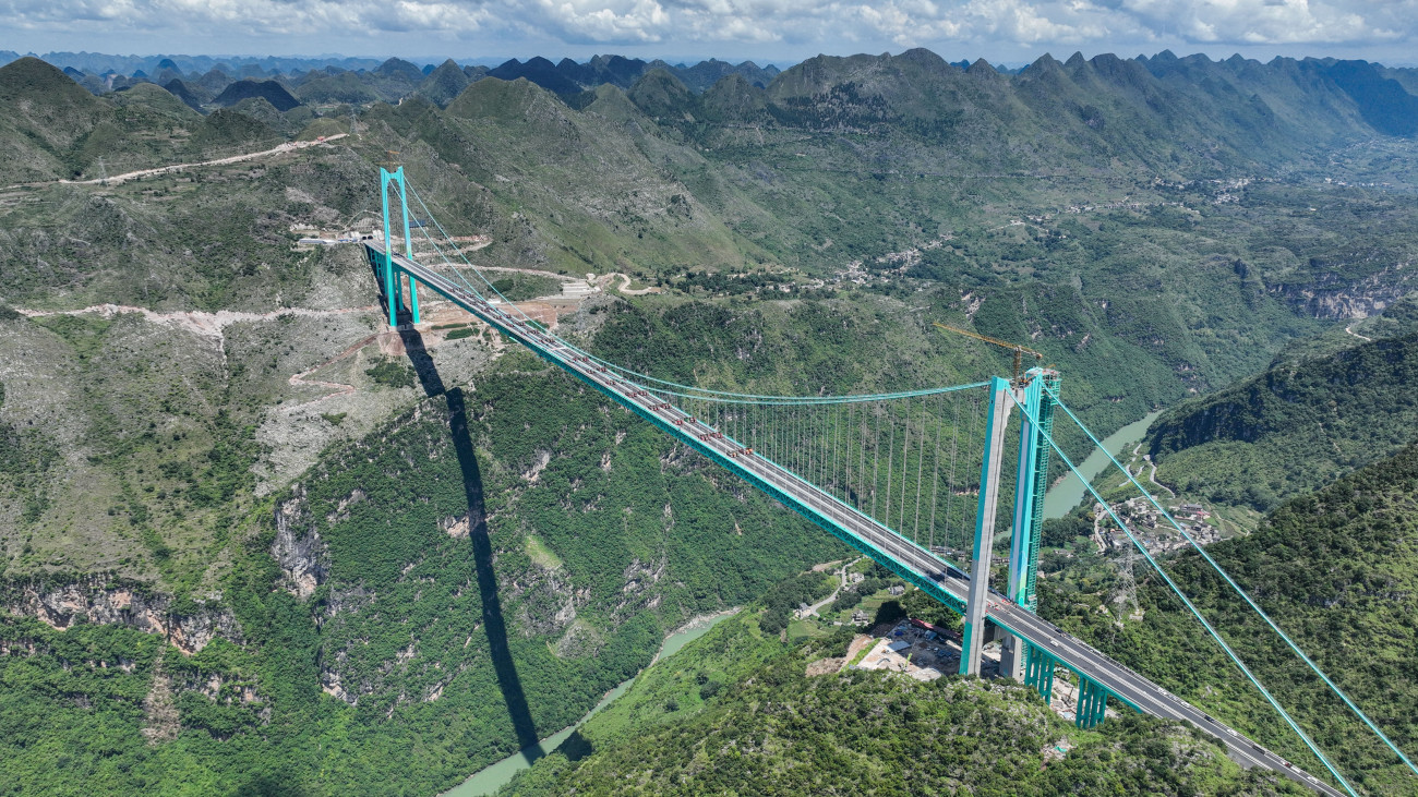 ANSHUN, CHINA - AUGUST 25: A load testing on the Huajiang Grand Canyon Bridge is in progress on August 25, 2025 in Anshun, Guizhou Province of China. With a maximum load capacity of 3,360 tons.The worlds tallest bridge, Chinas Huajiang Grand Canyon Bridge, underwent the final stage of its static load test on August 25, with 96 test trucks loading onto the bridge.