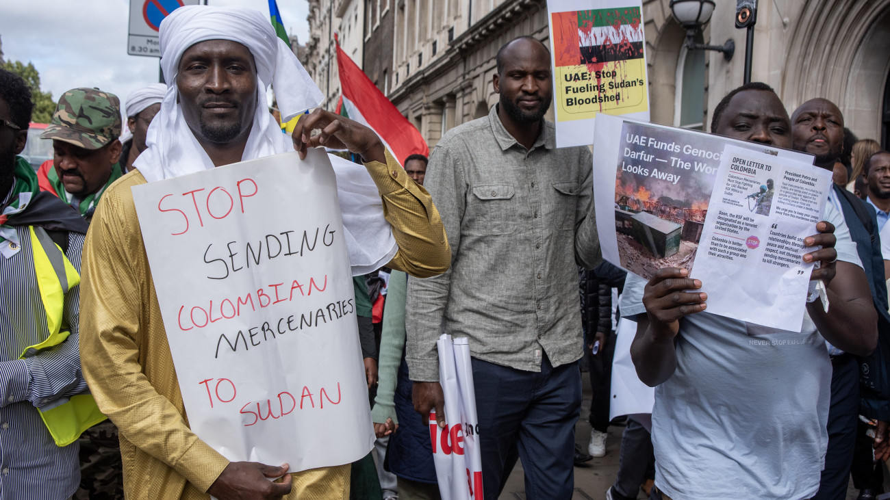 LONDON, UNITED KINGDOM - 2025/08/30: Protesters hold placards during the demonstration. Hundreds of Darfurians gathered on Whitehall to demand peace in Darfur, Sudan. Also, they accused the United Arab Emirates (UAE) of siding with Janjaweed paramilitary group and the Colombian government for sending mercenaries to Sudan. (Photo by Krisztian Elek/SOPA Images/LightRocket via Getty Images)