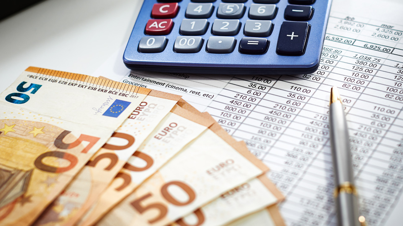 European Union currency with calculator, accounting concept, money, business, taxes, monthly expenses and personal finance, financial planner sheet