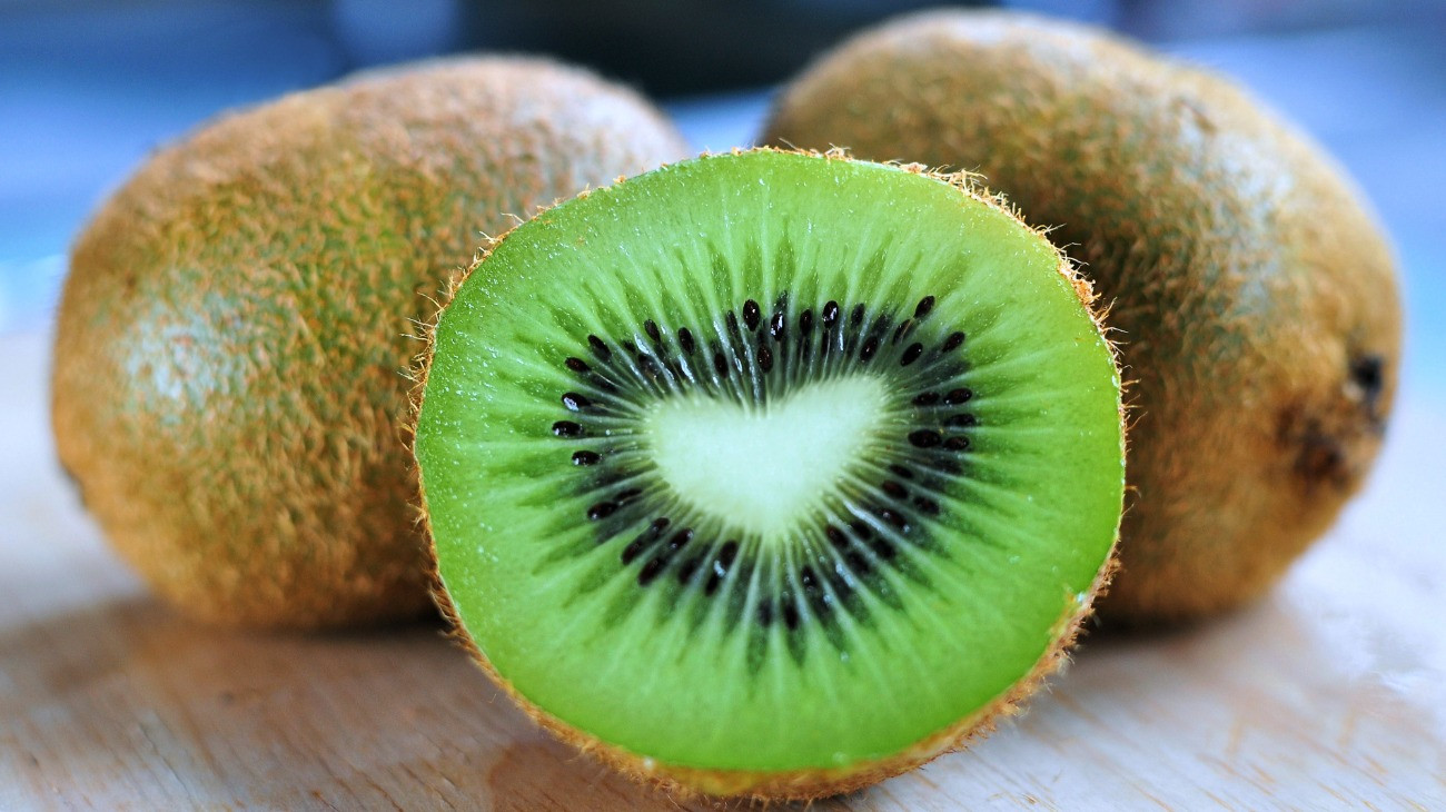 kiwi fruit with a heart shaped center.