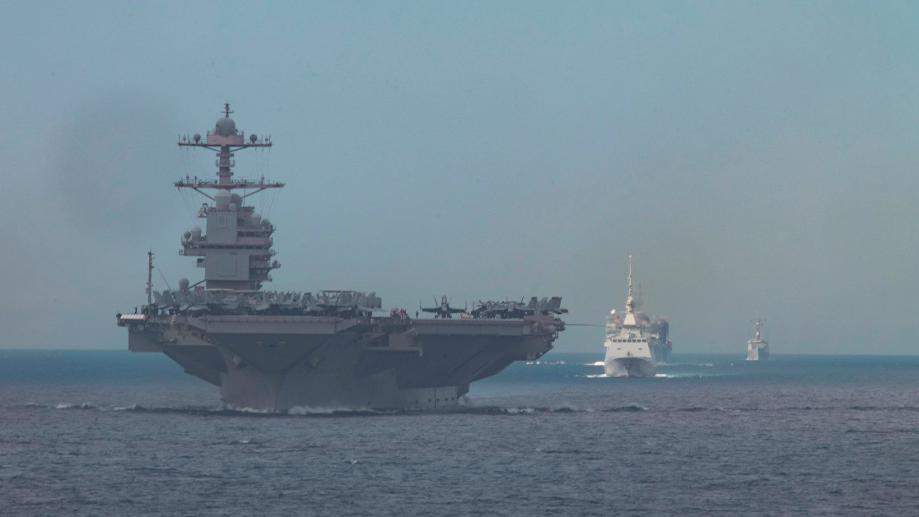 At Sea - OCTOBER 1: In this handout provided by the U.S. Navy, The USS Gerald R. Ford (CVN 78), front, transits the Strait of Gibraltar in formation with the Royal Moroccan Navy FREMM multipurpose frigate Mohammed VI (701), second from front, fast combat support ship USNS Supply (T-AOE 6), and the Arleigh Burke-class guided-missile destroyer USS Paul Ignatius (DDG-117), on October 1, 2025. Carrier Strike Group 12 is on a scheduled deployment in the U.S. 6th Fleet area of operation to support the warfighting effectiveness, lethality and readiness of U.S. Naval Forces, Europe-Africa, and defend U.S., Allied and partner interest in the region. (Photo by /U.S. Navy via )