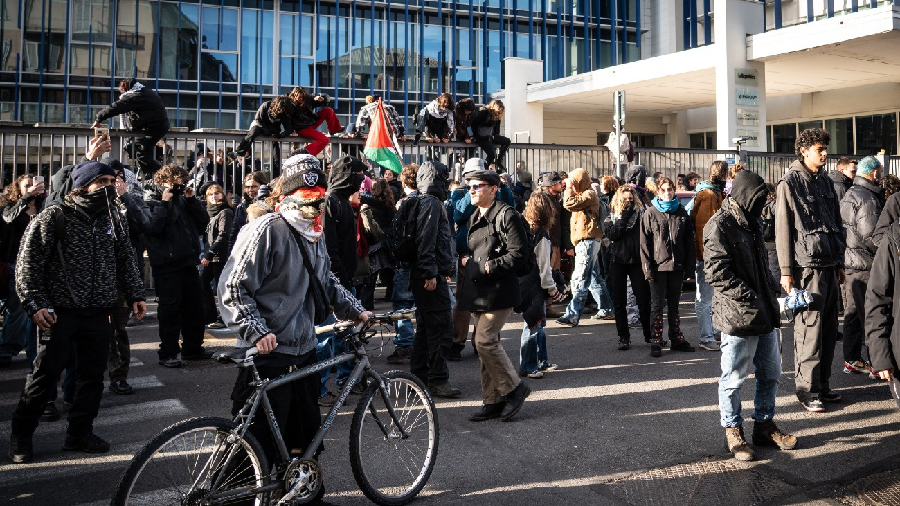 Students exit the headquarters of the newspaper La Stampa because of the arrival of the riot police in Turin, Italy, on November 28, 2025. (Photo by Elisa Marchina/NurPhoto via Getty Images)