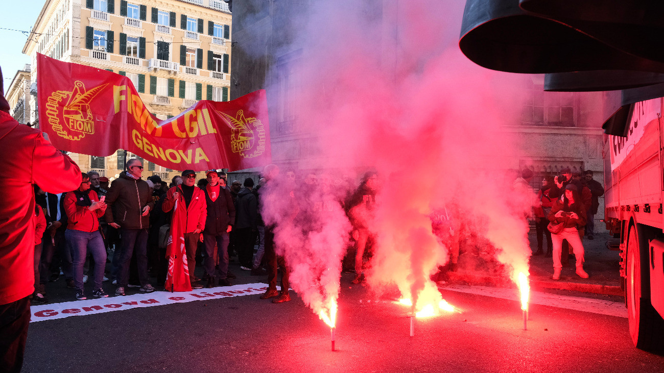 GENOA, ITALY - DECEMBER 12: The general strike march arrives in front of the cityâs prefecture on December 12, 2025 in Genoa, Italy. CGIL Union has called a general strike of public and private sector workers to walk out in protest at the governments 2026 budget law and demands higher wages, pension protections, increased public investment and social-welfare reforms. (Photo by Emanuela Zampa/Getty Images)
